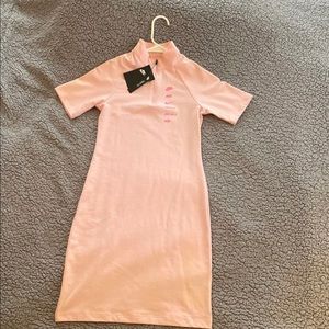 Womens Nike light pink form fitting 1/4 zippered dress. Size S.